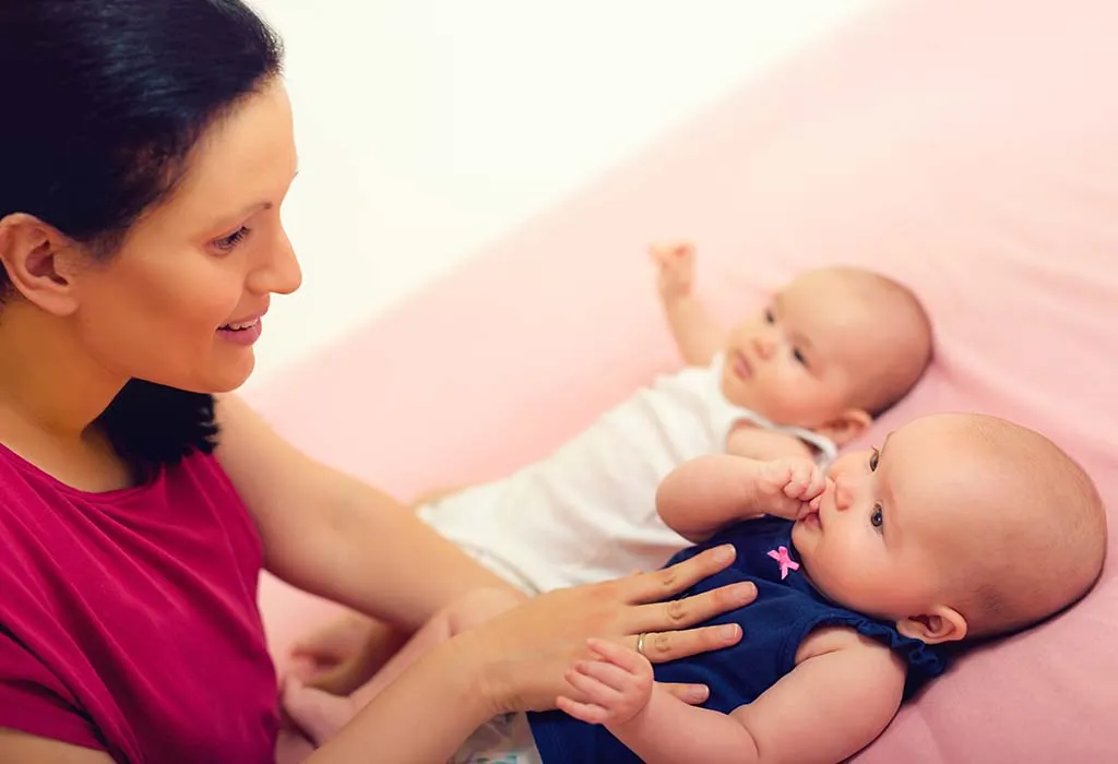 mother singing to twins