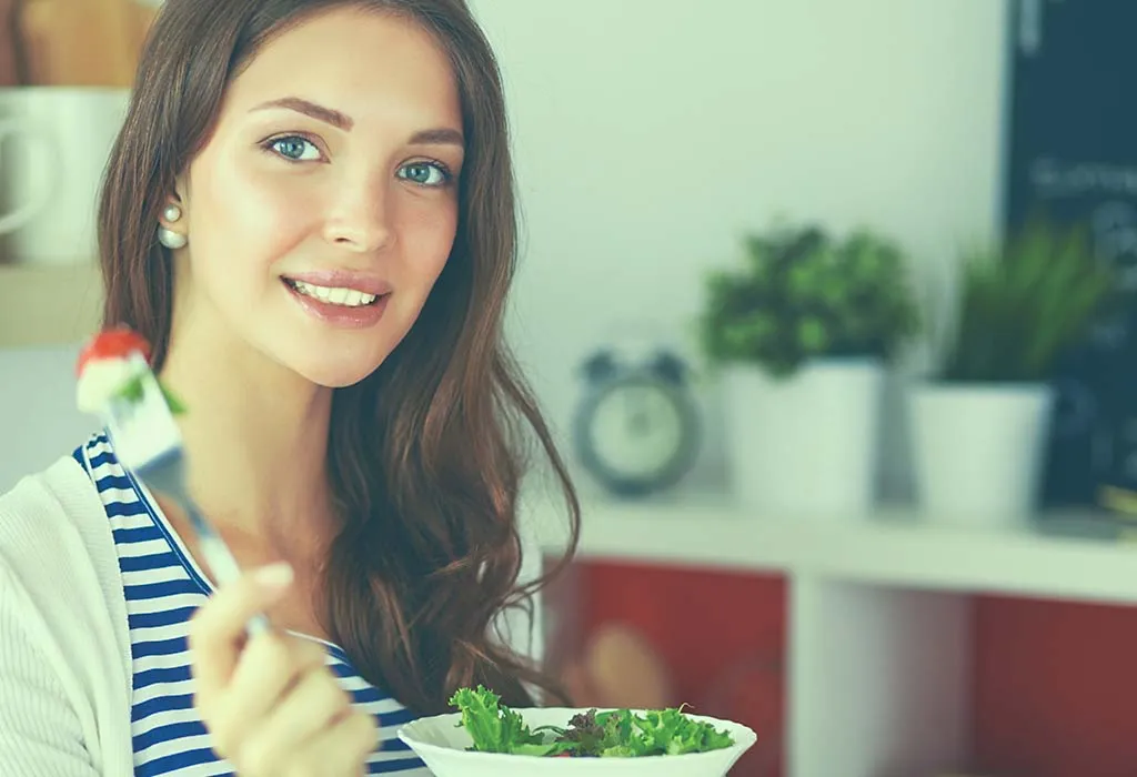 Woman eating salad