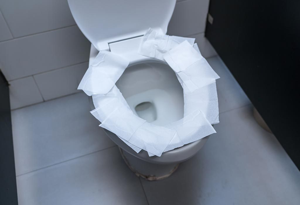 Toilet paper on toilet seat