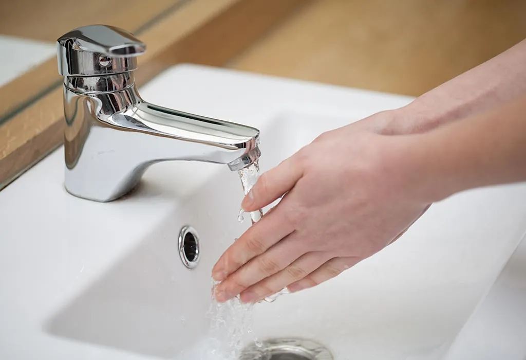 A woman washing her hands