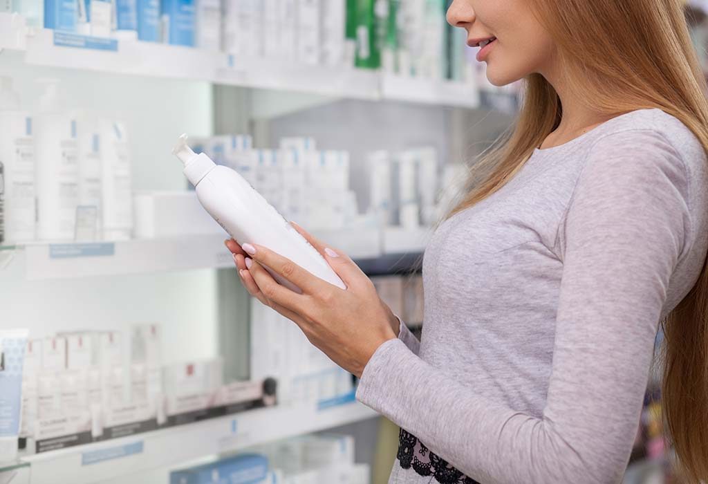 A woman reads the label of a product