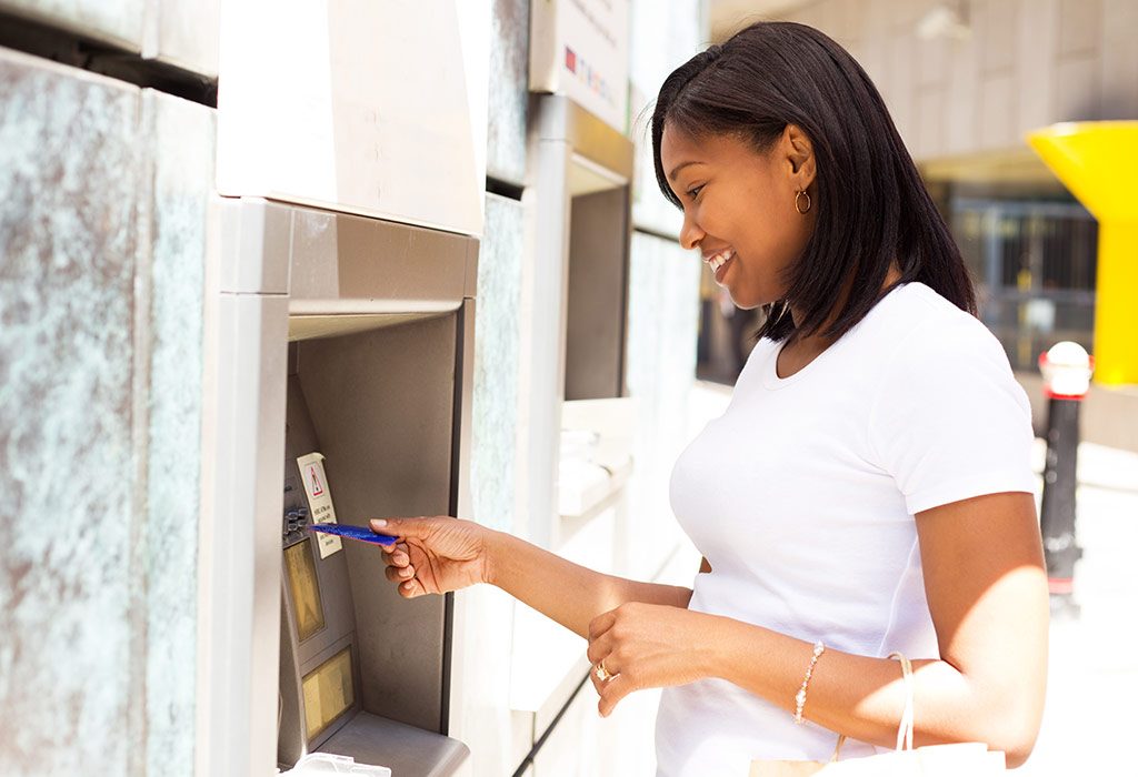 Woman at an ATM machine