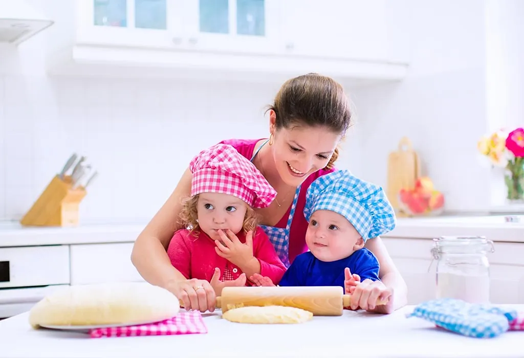 Toddlers cooking with mom