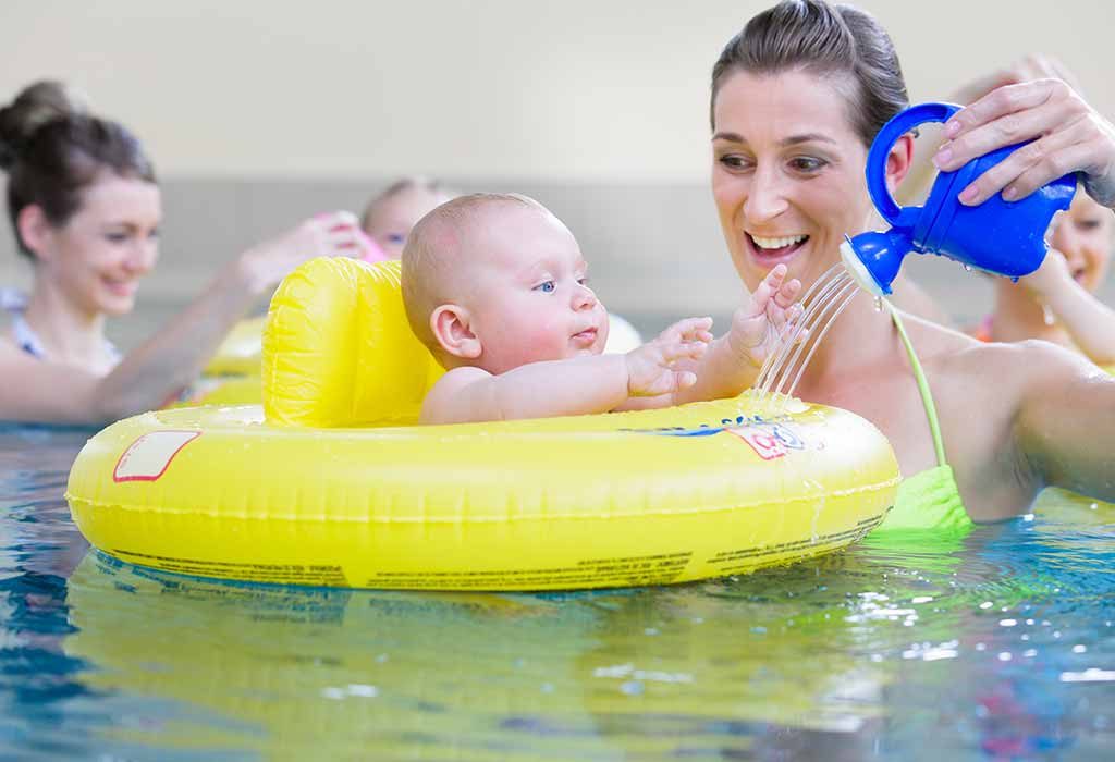 mom and child playing in a pool
