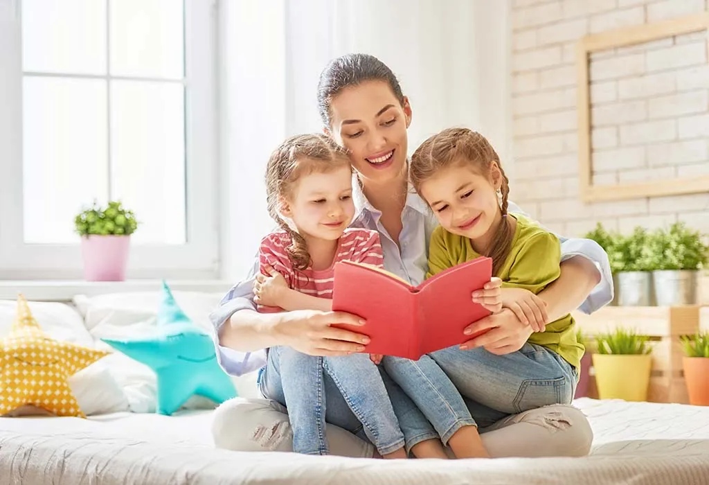 A mom reading to her girls