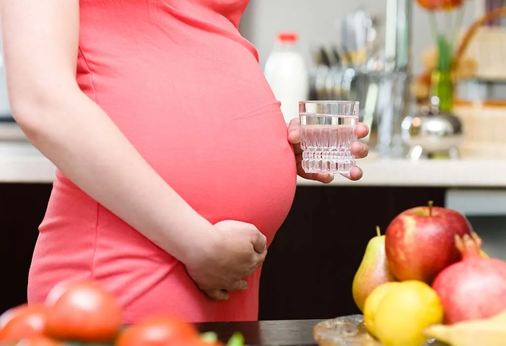 Pregnant woman drinking water