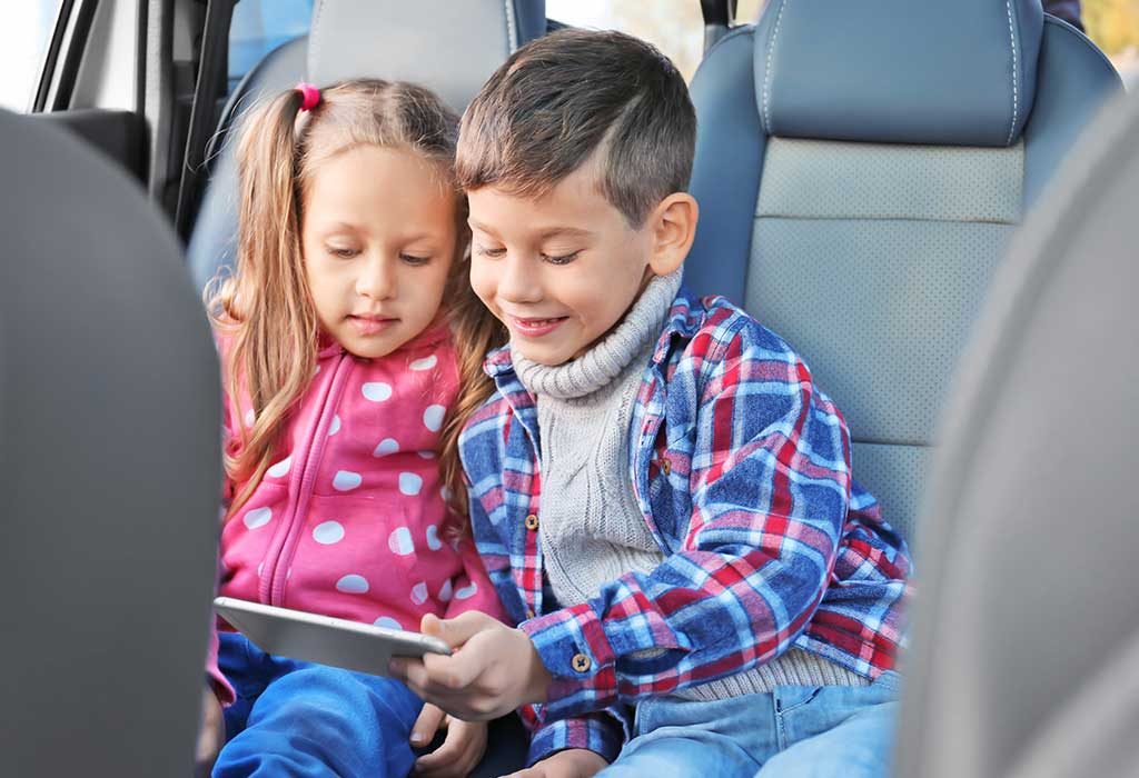 Kids playing on their phone in the car