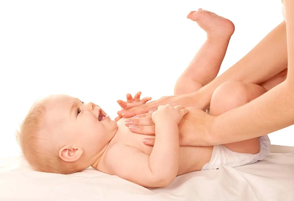 mother massaging baby