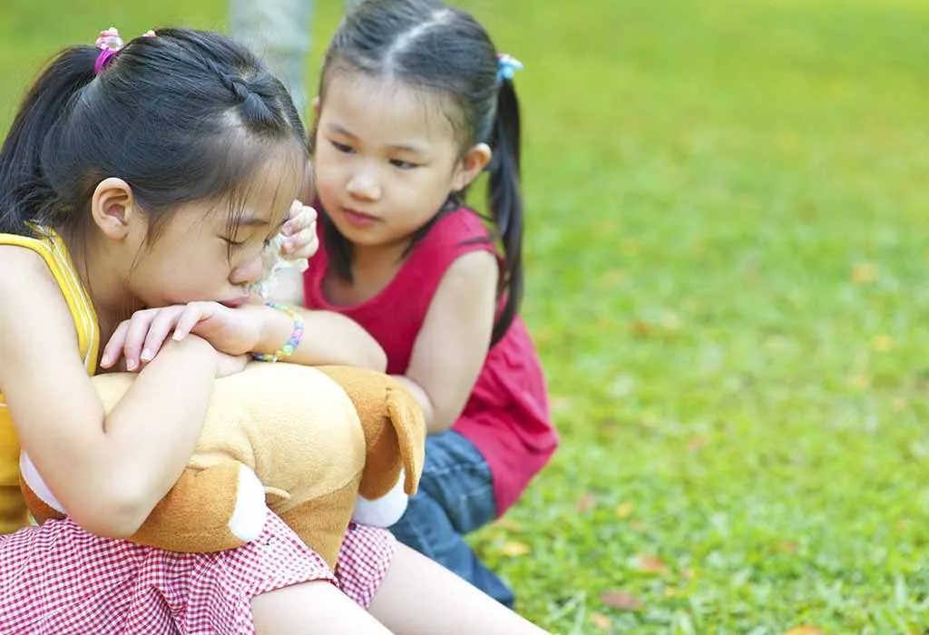 child consoling a friend