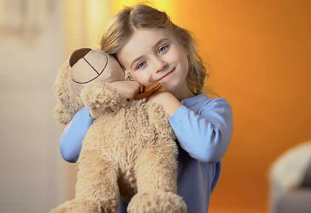 child holding favourite toy