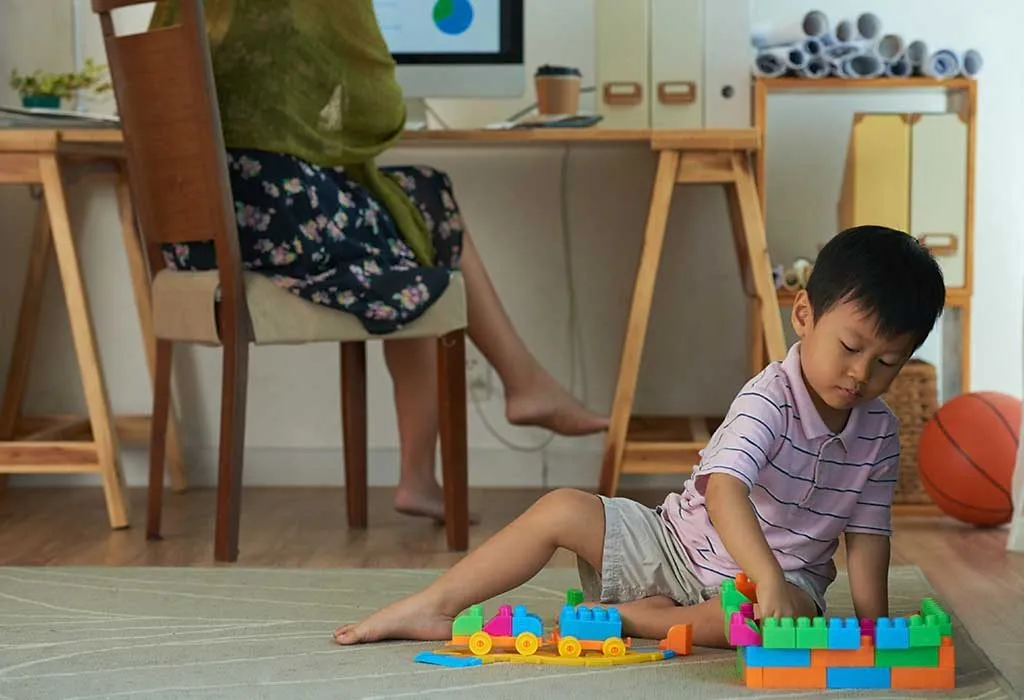 child engrossed in playing a game