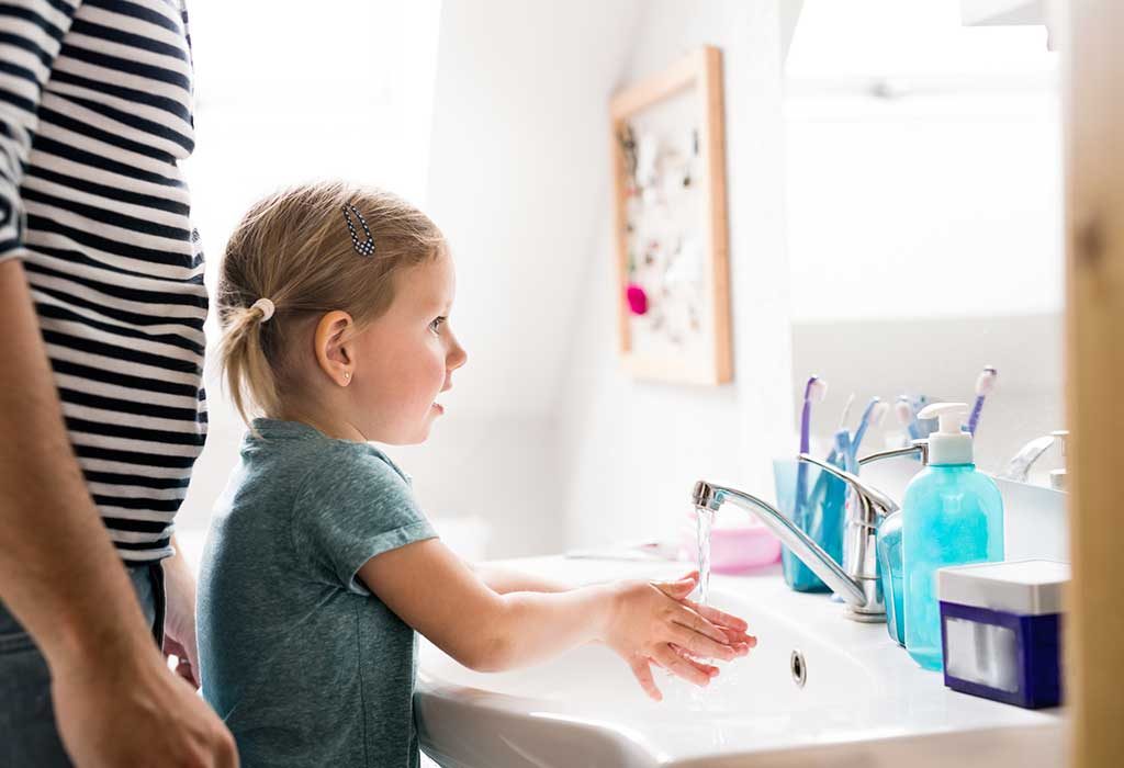 child washing hands