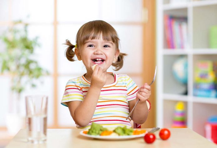 toddler enjoying a healthy meal