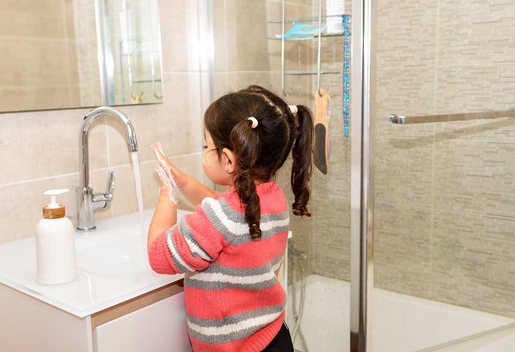 child washing hands