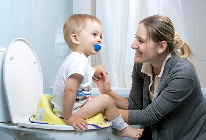 Parent potty training her child