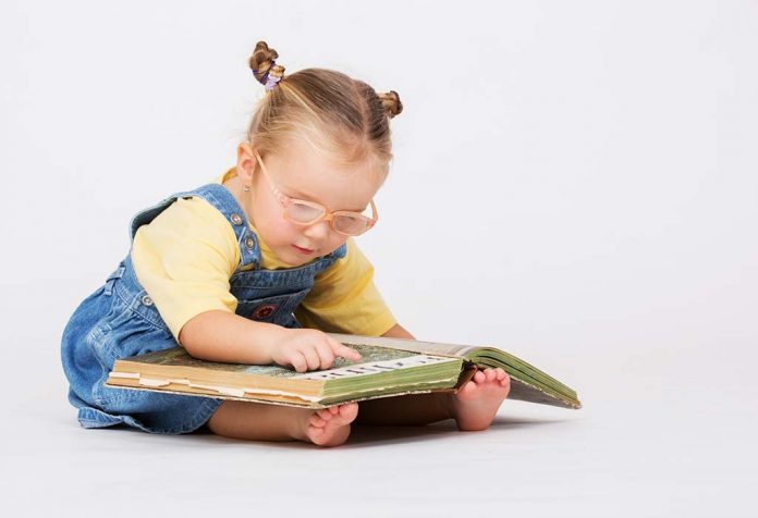 toddler reading a picture book