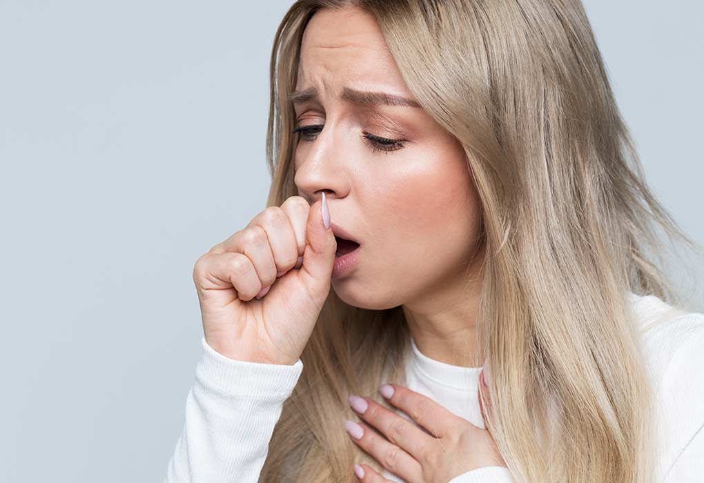 woman coughing covid 19