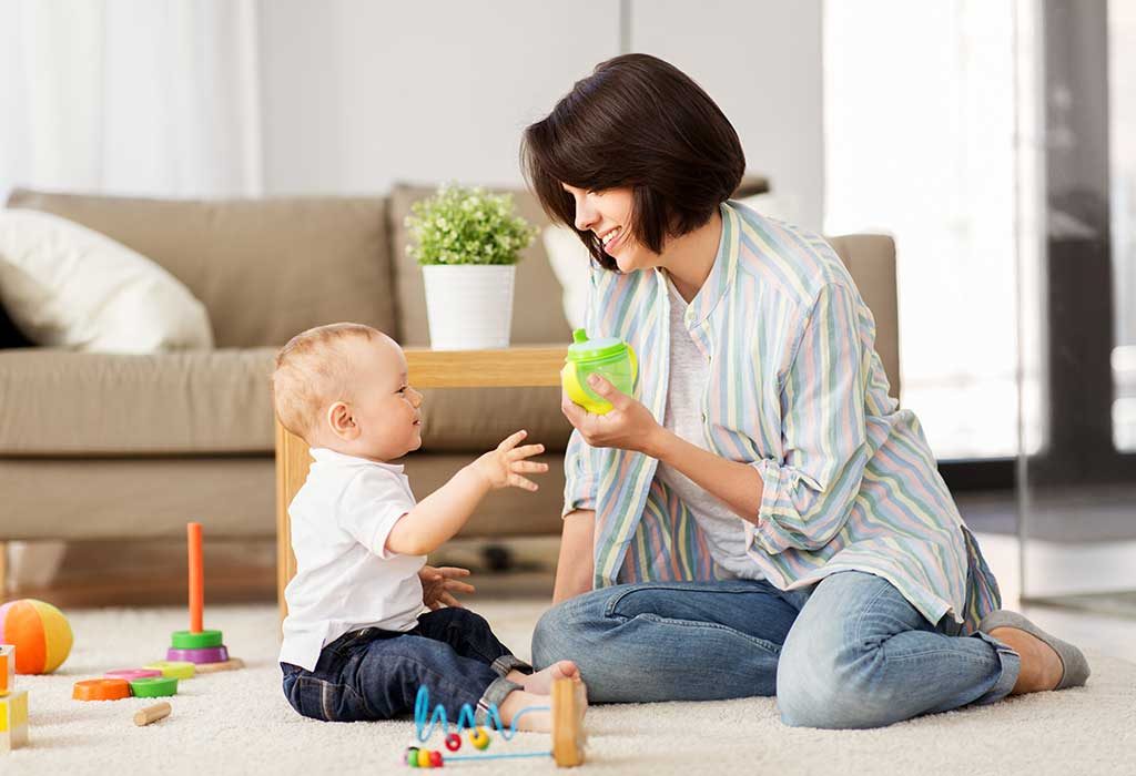 toddler drinking from sippy cup
