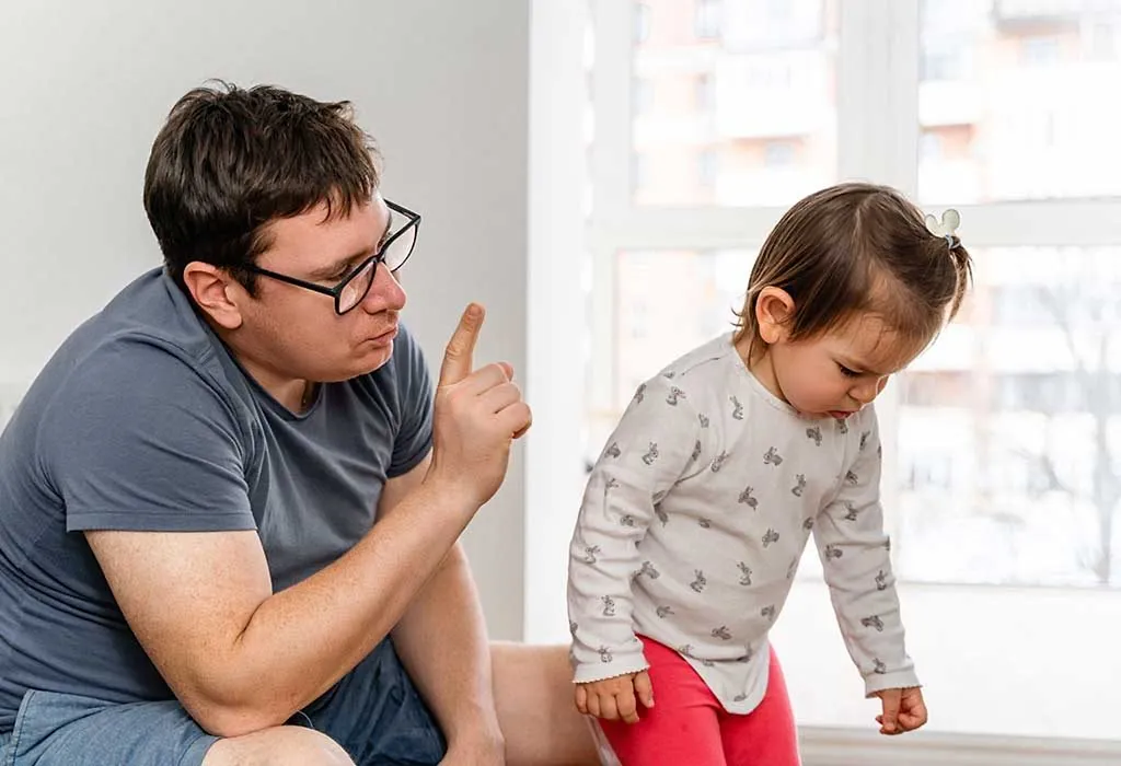 Parent disciplining toddler