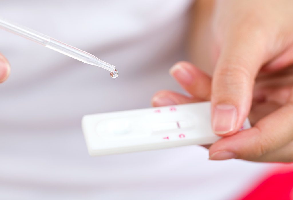 A woman taking a pregnancy test