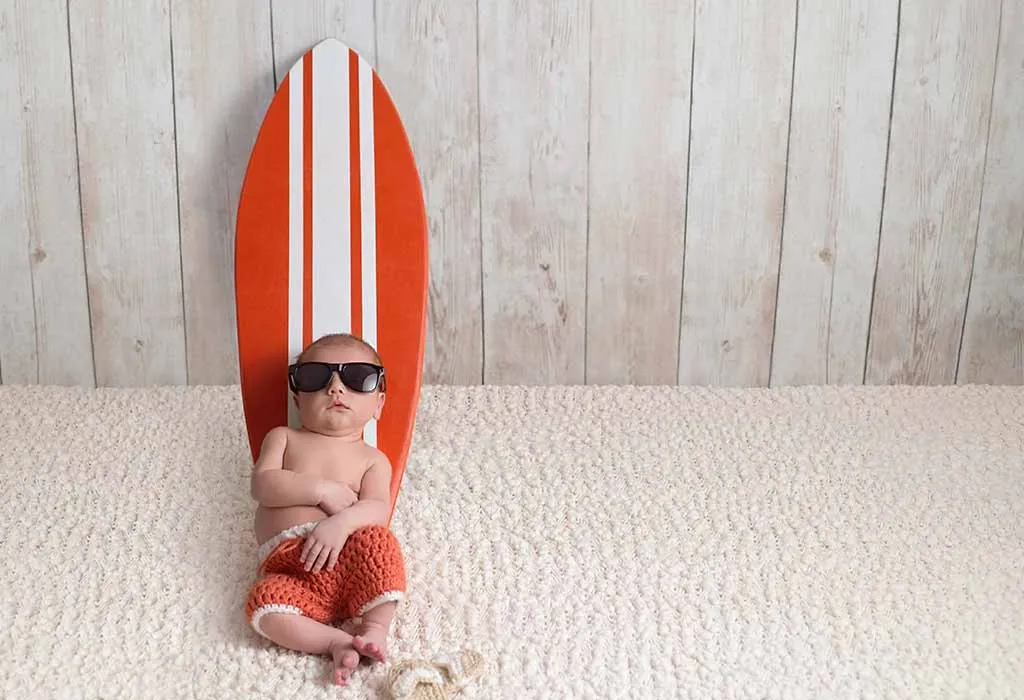Baby leaning on a surfboard Baby leaning on a surfboard