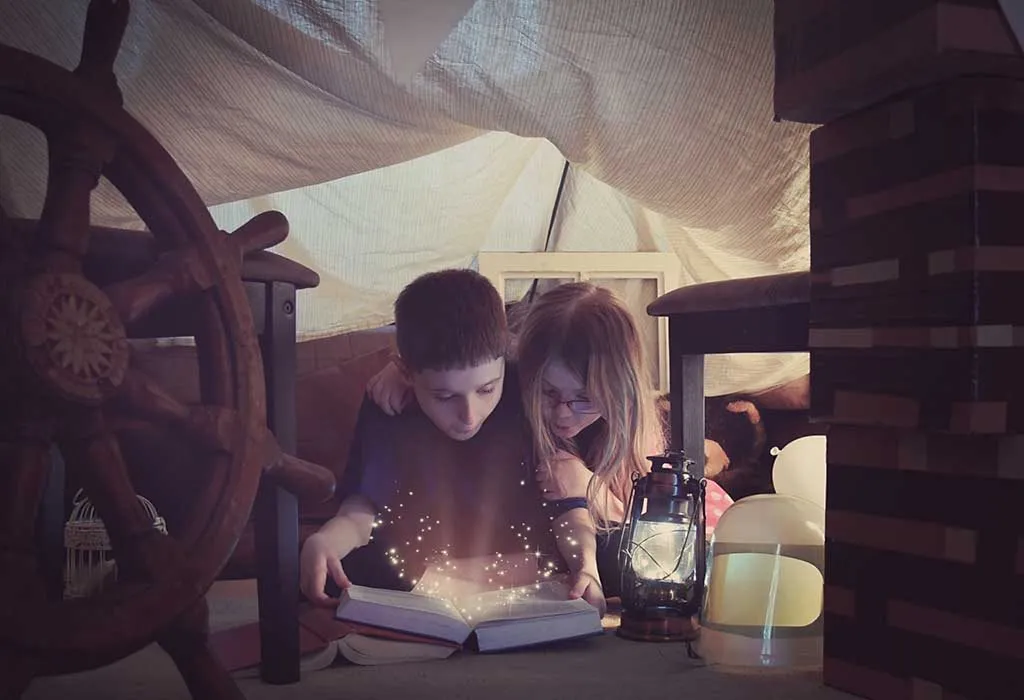 2 kids reading a fantasy book together