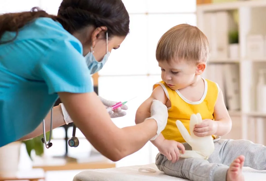 nurse giving a toddler an immunization shot