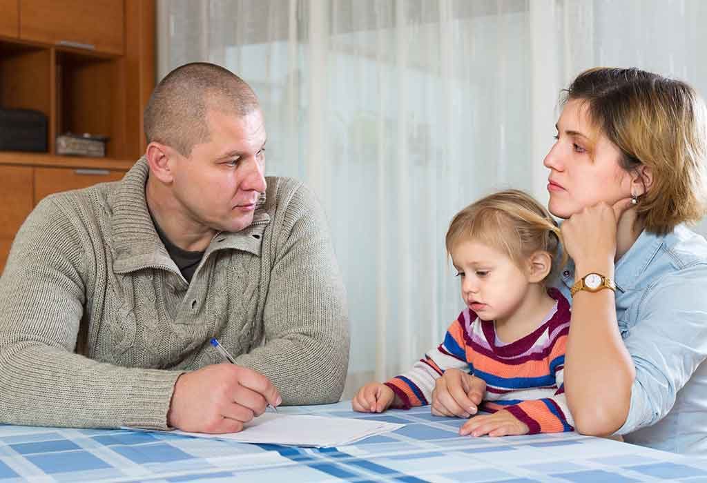 A divorced couple discussing parenting plan