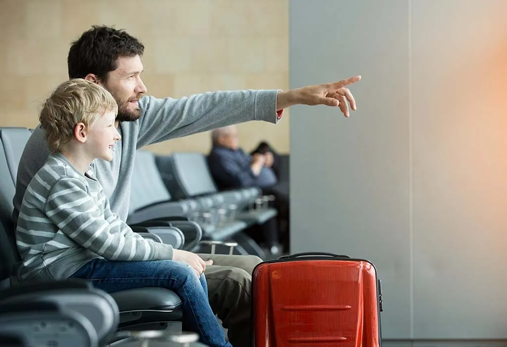 A parent travelling with his child