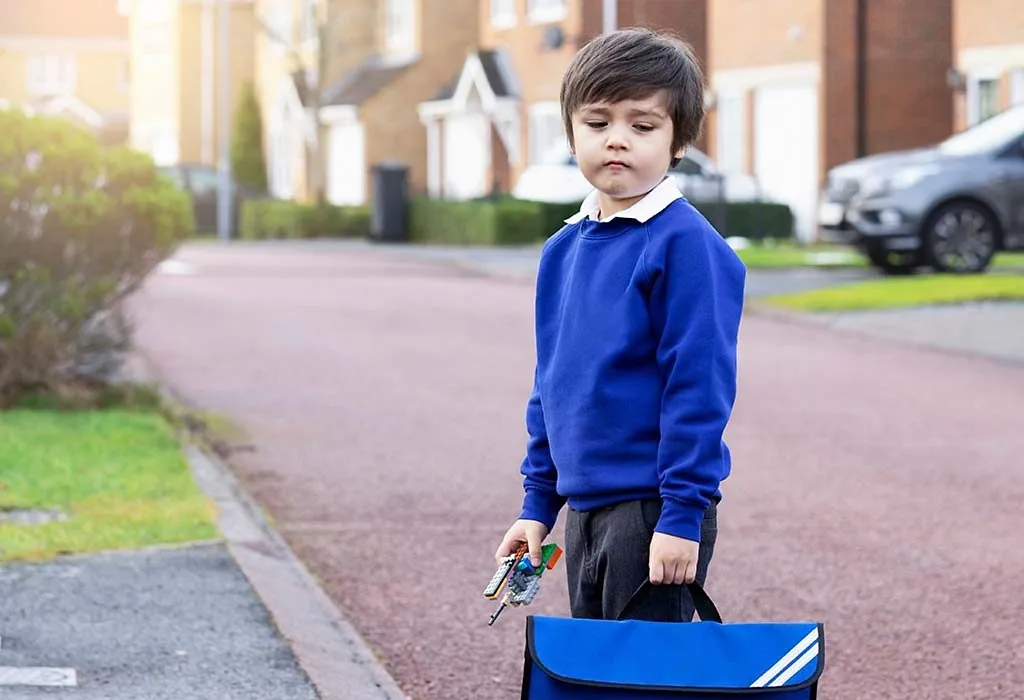 A child in school uniform - sad