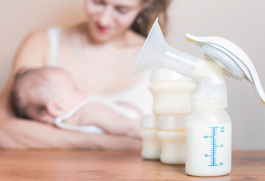 A woman breastfeeding and bottle-feeding