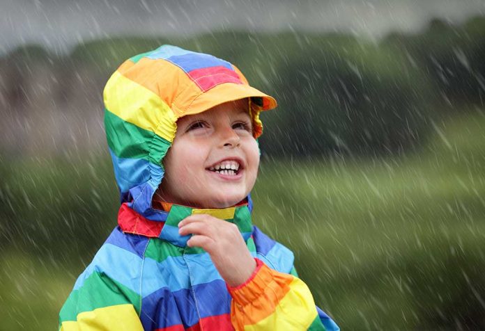 kid enjoying the rains