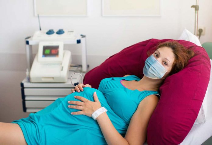 woman waiting for delivering baby during COVID