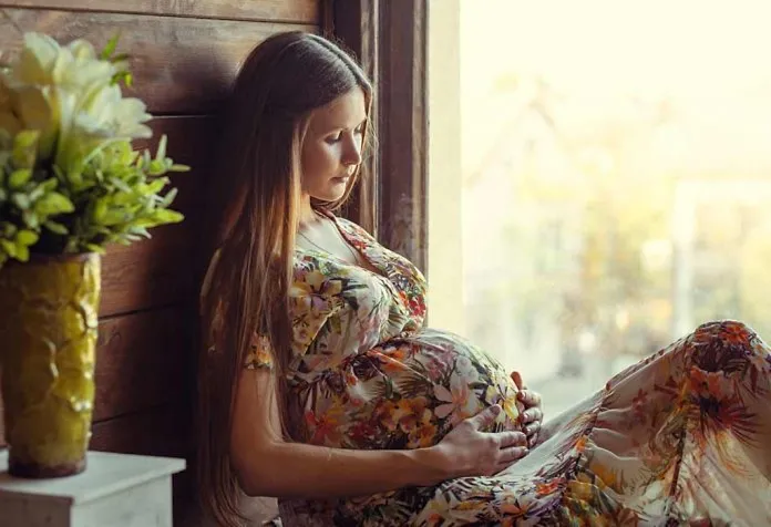 expecting mom observing her baby's movement