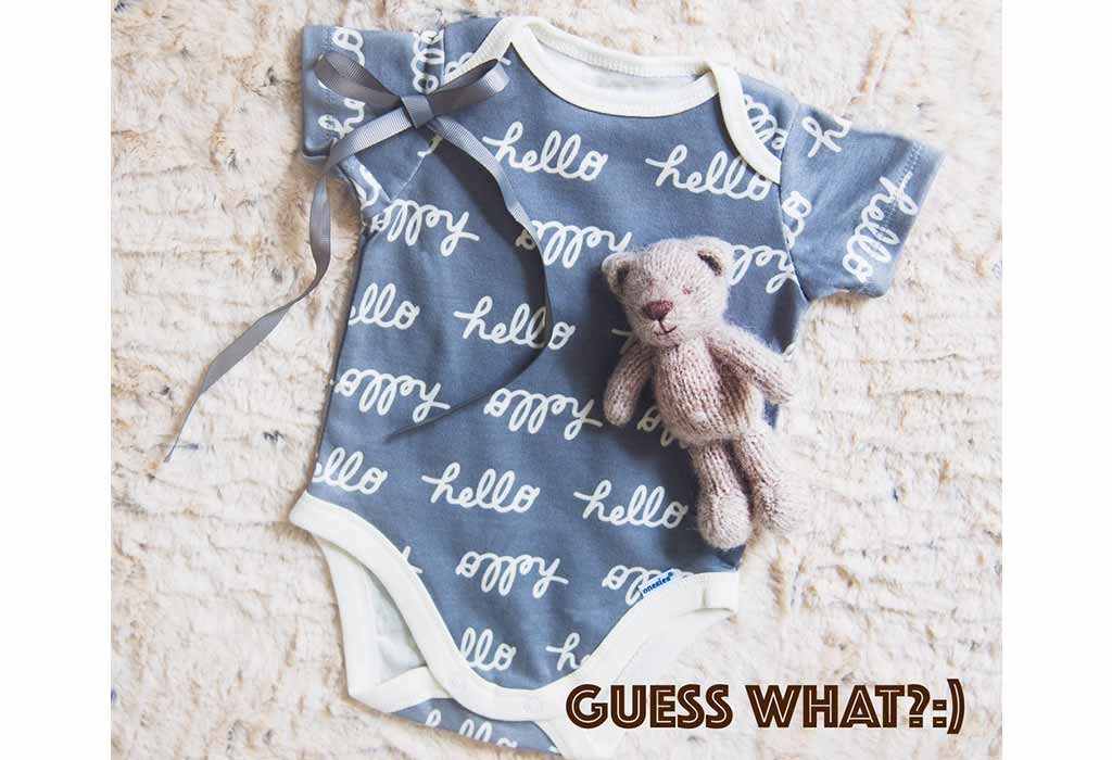 Pregnancy announcement with baby outfit picture