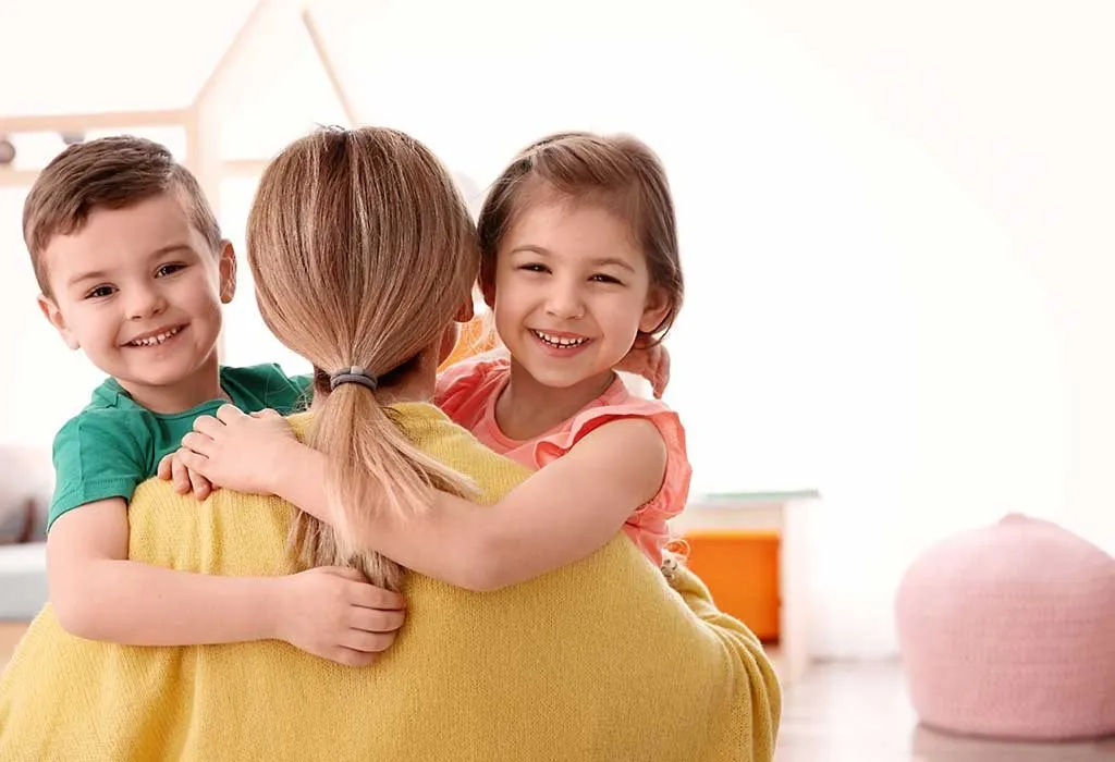kids hugging babysitter