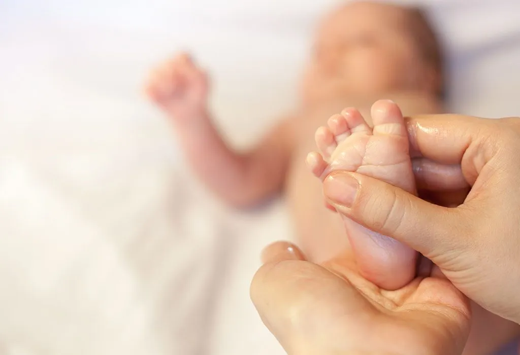 baby's foot being massaged