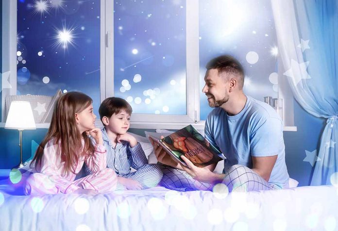 father reading bedtime stories to kids