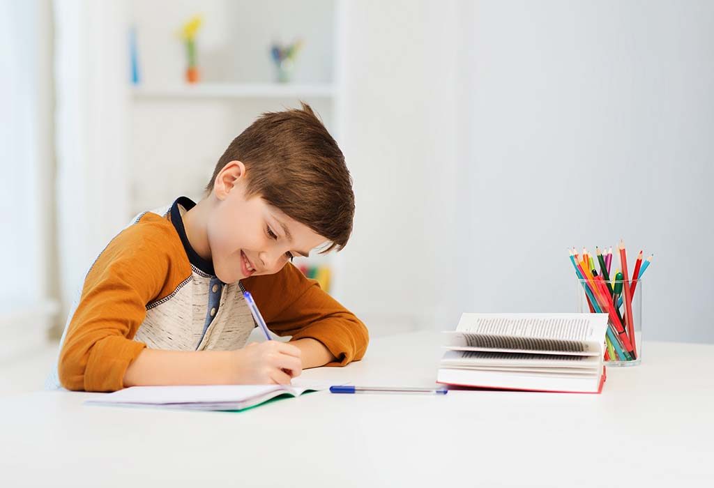 kid writing in workbook