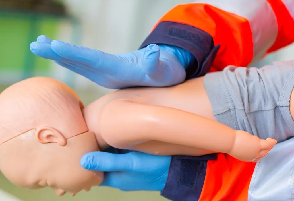volunteer demonstrating the back blow technique for choking babies