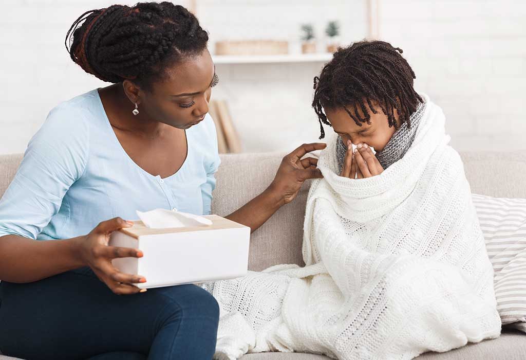 Mom comforting unwell child