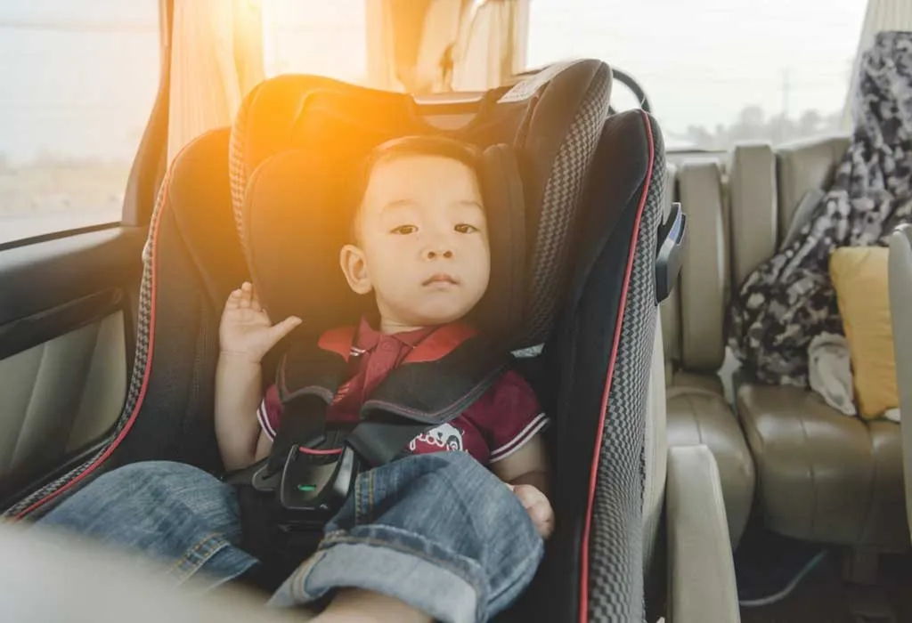 Child secured in a booster seat