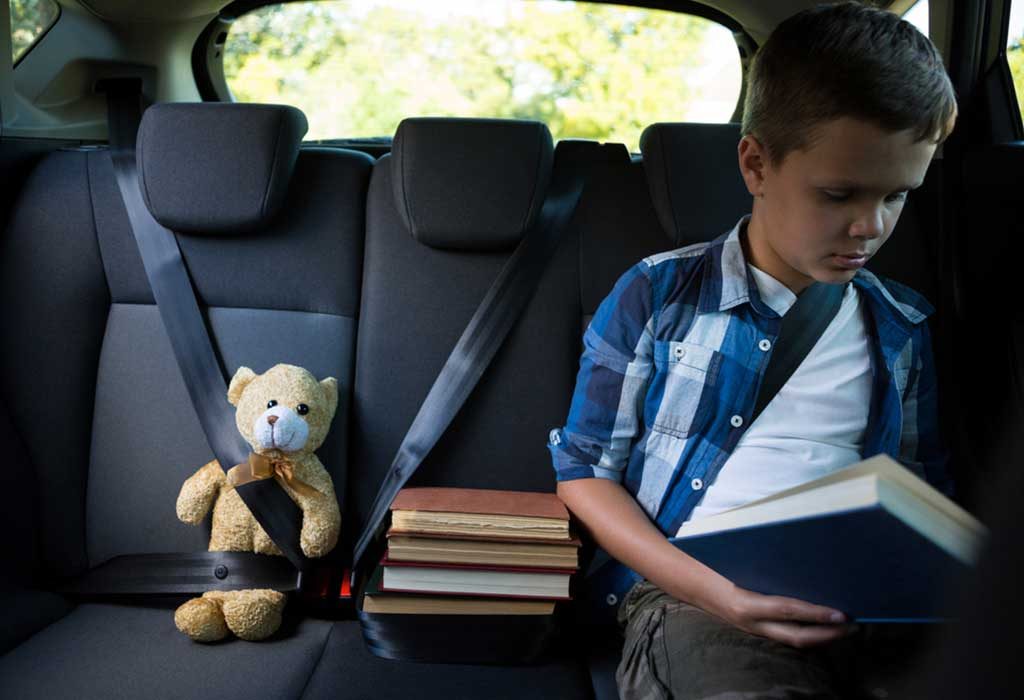 Child sitting in front of car sale