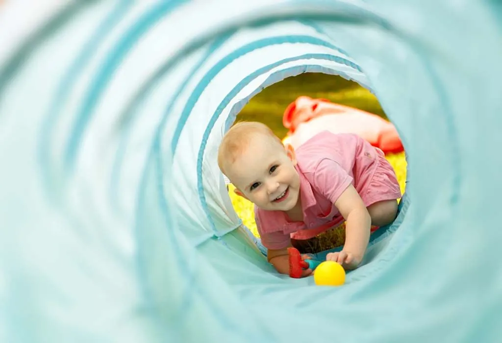 Child playing in tunnel