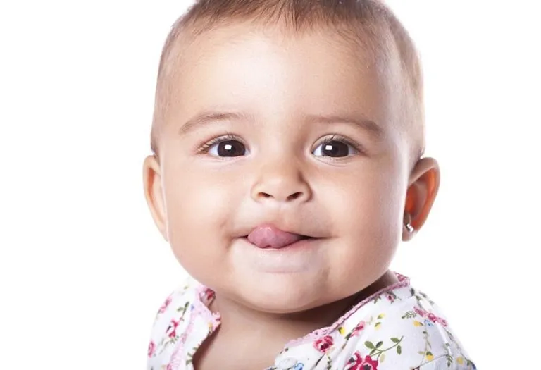 Common Reasons Why Babies Stick Their Tongue Out - Should You Worry?