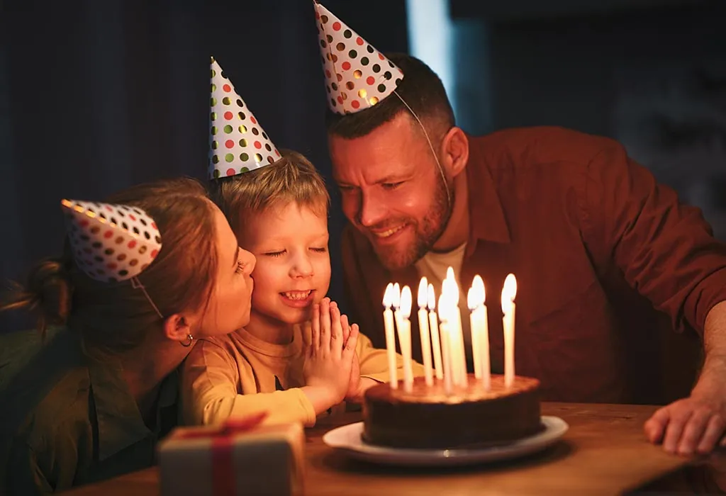 Little Boy Celebrating Birthday With Parents