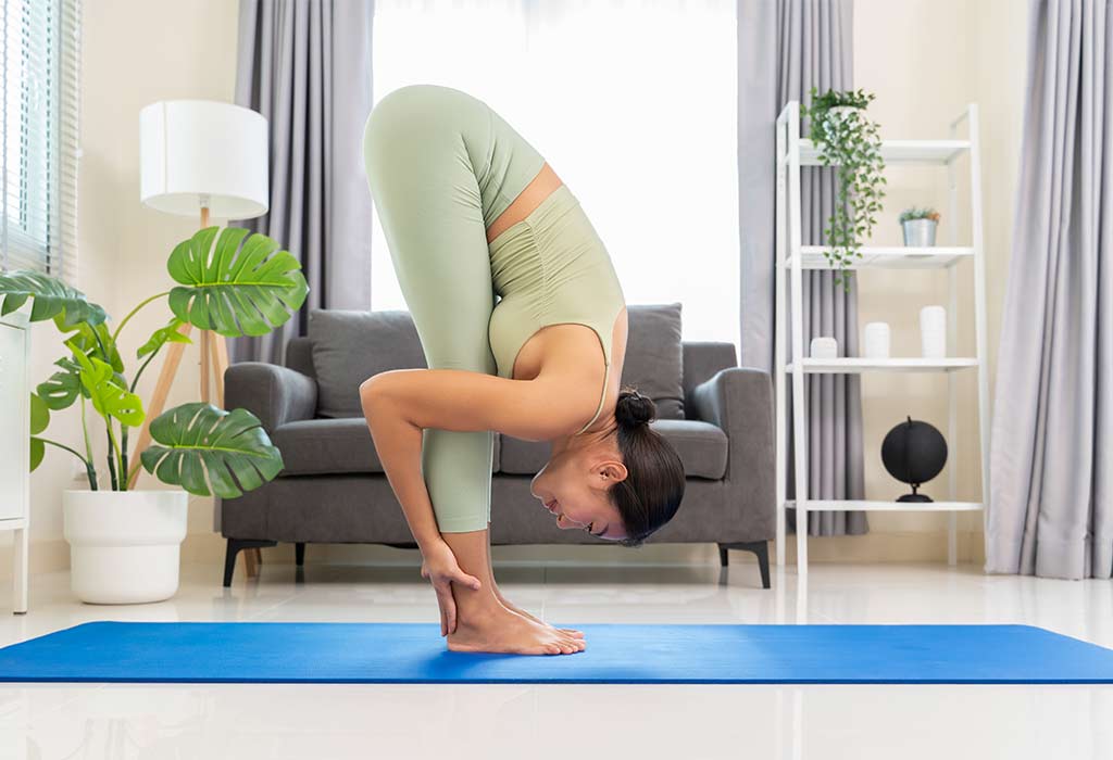 Positions That Will Relieve Gas While Pregnant - Standing Forward Fold