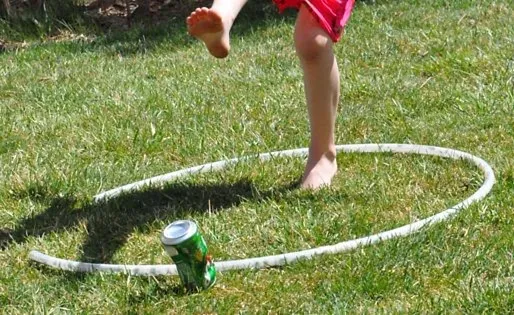 Child kicking a can