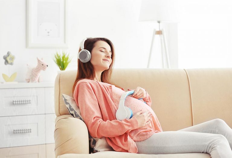 30+ Best Pregnancy Songs to Soothe, Relax, and Bond With Baby