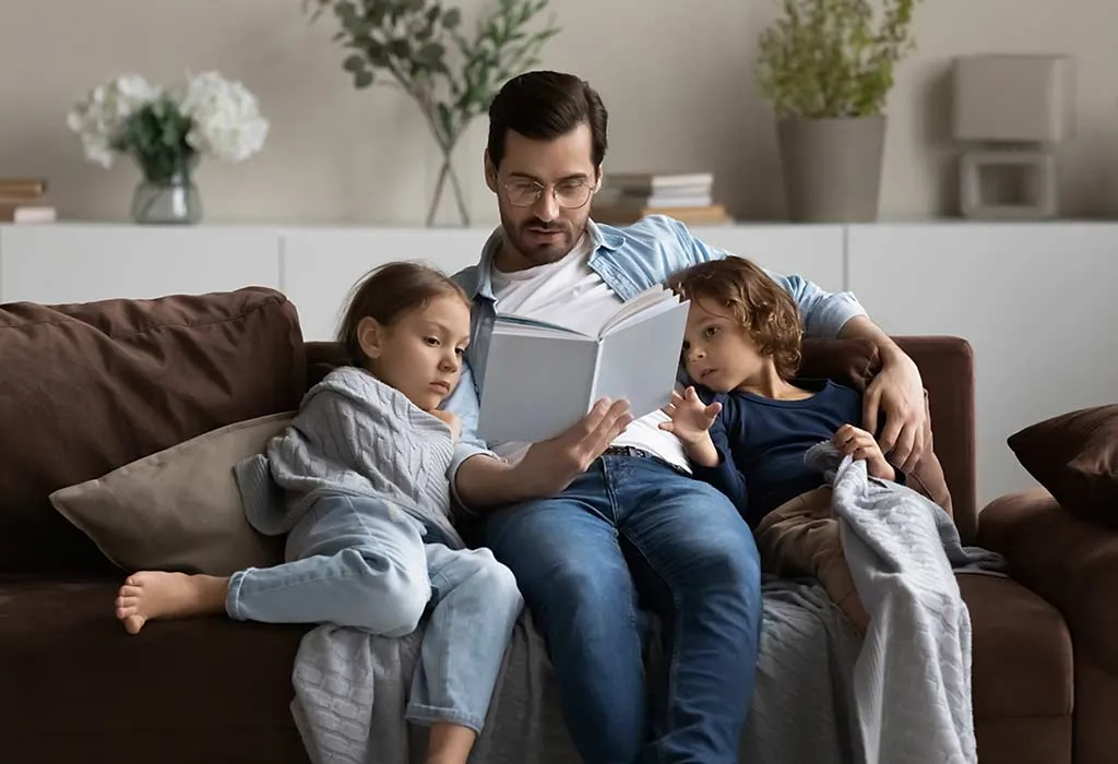 Dad Reading a Book to Kids